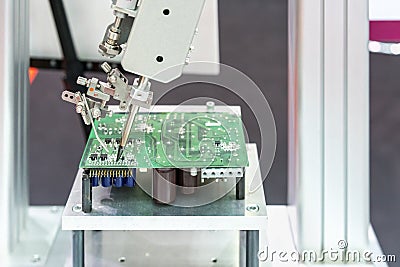 High technology and modern automatic robot for pcb print circuit board assembly machine during soldering or welding part or Stock Photo