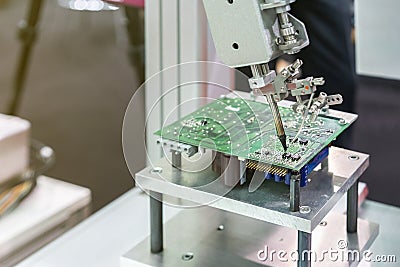 High technology and modern automatic robot for pcb print circuit board assembly machine during soldering or welding part or Stock Photo