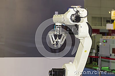 High technology and precision robot arm with grip for catch product in manufacturing process Stock Photo