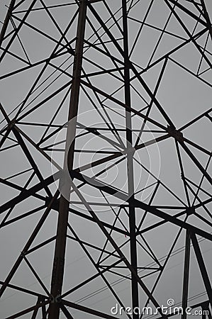 A high tension power pole offers unique geometric shapes Stock Photo