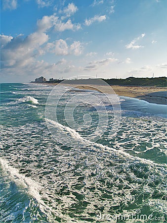 High Tide and Turquoise Green Water at Juno Beach Stock Photo