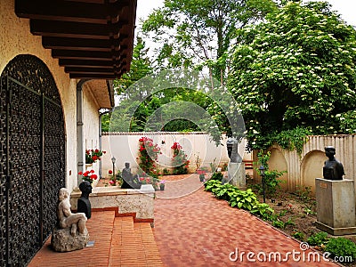 High value statuary outdoor in the inner courtyard at the Zambaccian Museum, Bucharest, Romania. Editorial Stock Photo