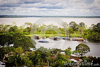 High view of Amazon River and local houses Stock Photo