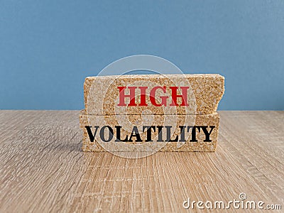 High volatility symbol. Concept red words High volatility on brick bloks. Beautiful blue background. Business high volatility Stock Photo