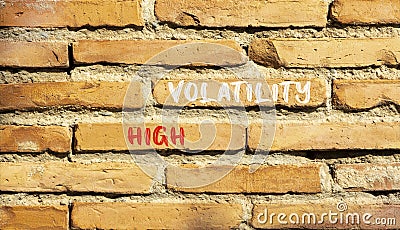 High volatility symbol. Concept words High volatility on beautiful brick wall. Beautiful red brown brick wall background. Business Stock Photo