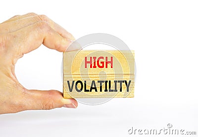 High volatility symbol. Concept words High volatility on beautiful wooden blocks. Beautiful white table white background. Stock Photo
