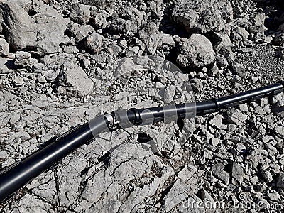 the high voltage cable is attached to the limestone rock using Stock Photo