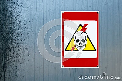 High voltage danger sign with human skull and lightning Stock Photo