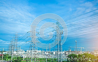 High voltage electric tower line. Silhouette of Power Supply Facilities with blue sky background Stock Photo