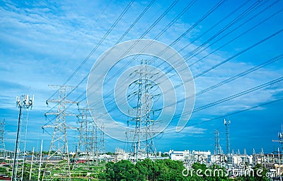 High voltage electric tower line. Silhouette of Power Supply Facilities with blue sky background Stock Photo