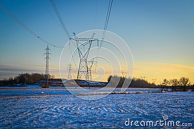 High voltage electricity transmission towers by aerial cables in winter Stock Photo