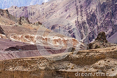 High voltage lines in Lamayuru moonland, picturesque lifeless mountain landscape on a section of the Leh-Kargil route Stock Photo