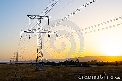 High voltage pole during sunset Stock Photo