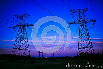 high-voltage power lines at sunset. electricity distribution sta Stock Photo