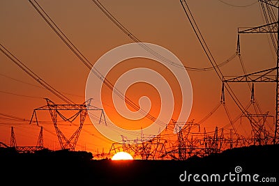 High voltage transmission tower during sunset Stock Photo