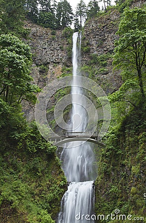 High waterfall with a bridge Stock Photo