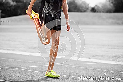 Highlighted bones of athlete man stretching on race track Stock Photo