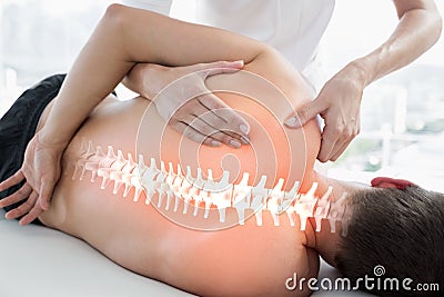 Highlighted bones of man at physiotherapy Stock Photo