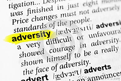 Highlighted English word `adversity` and its definition in the dictionary Stock Photo