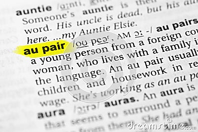 Highlighted English word `au pair` and its definition in the dictionary Stock Photo