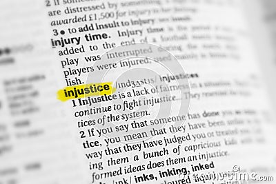 Highlighted English word & x22;injustice& x22; and its definition at the dictionary Stock Photo