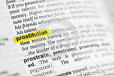 Highlighted English word & x22;prostitution& x22; and its definition at the dictionary Stock Photo