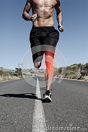 Highlighted knee of running man Stock Photo