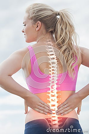 Highlighted spine of woman with back pain Stock Photo