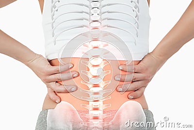 Highlighted spine of woman with back pain Stock Photo