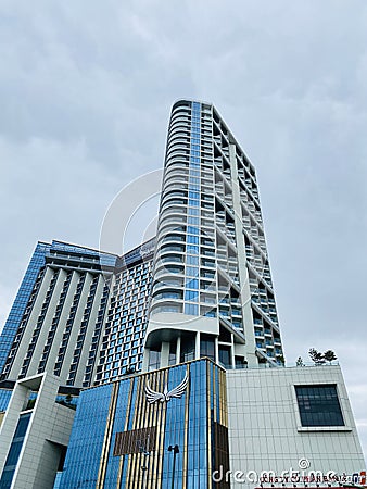 Blue modern luxury glass building low angle on a cloudy sky. Muong Thanh Hotel in Quang Ninh, Vietnam Editorial Stock Photo