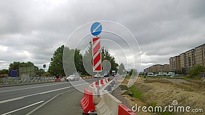 Highway construction and repair. Plastic red and white heavy duty water filled road barrier. Providing security and crowd or traff Editorial Stock Photo