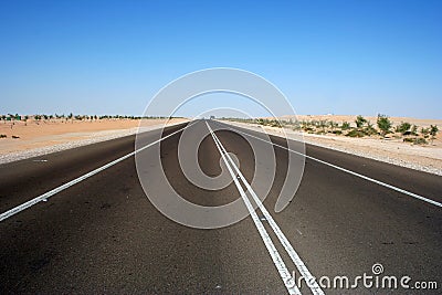 Highway through desert Stock Photo