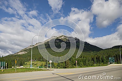 Highway in mountains Trans Canada Highway with a perfect asphalt at sunrise in summer. in Banff National Park, Alberta, Canada. Editorial Stock Photo