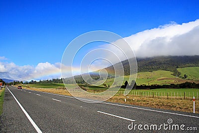 Highway And Rainbow Stock Photo