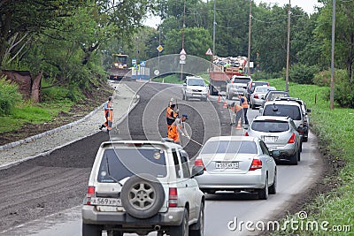 Highway repair and stopping traffic Editorial Stock Photo