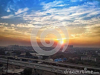 Highway road and cityscape of delhi town india, cloudy dramatic sky Stock Photo