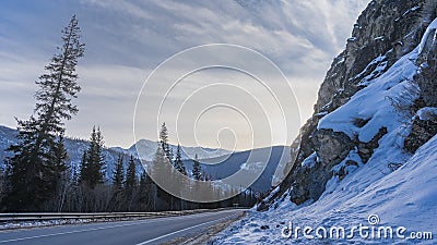 The highway runs along a steep mountain slope. Stock Photo