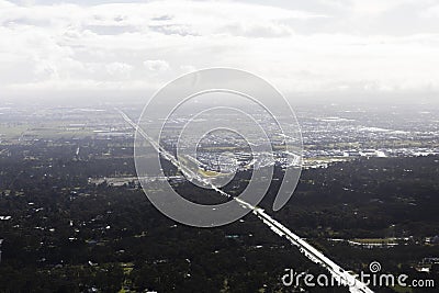 Highway Shining in Sunlight Over Refreshed Green Landscape After Rain Stock Photo