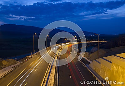 Highway traffic at dusk Stock Photo