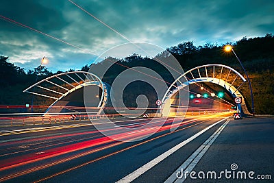 Highway tunnel at night Stock Photo