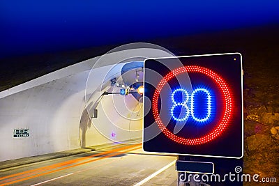 Highway tunnel with speed limit Stock Photo