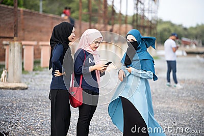 Hijab`s girl relaxing on the seaside Editorial Stock Photo