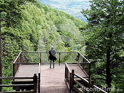 Hiker Admiring View of Catskill Mountains From Overlook Stock Photo