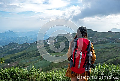 Hiker asian woman feeling victorious facing on the mountain, Thailand. Stock Photo