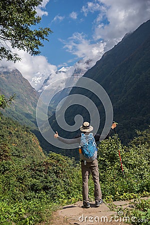 Hiker with backpack standing on the rock enjoy mountain view Annapurna ,Nepal. Editorial Stock Photo