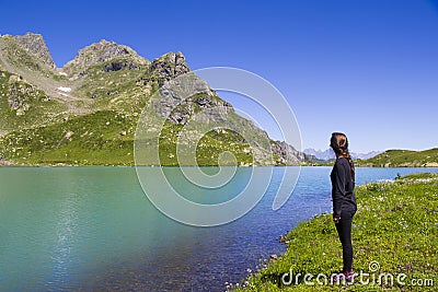 Hiker and backpacker in the mountain valley and field, trekking and hiking scene in Svaneti, Georgia Editorial Stock Photo