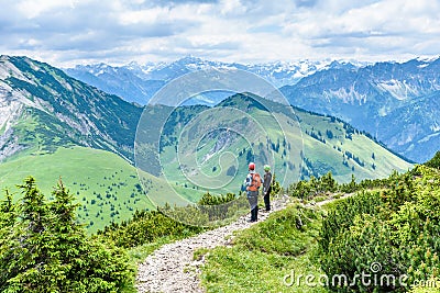 Hiker in beautiful landscape of Alps in Germany - Hiking in the mountains Editorial Stock Photo