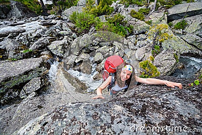 Hiker is climbing rocky slope of mountain in Altai mountains, Ru Stock Photo