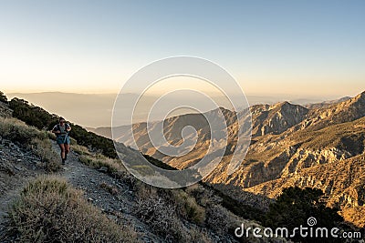 HIker Climbing Steep Trail to Telescope Peak In Death Valley Stock Photo