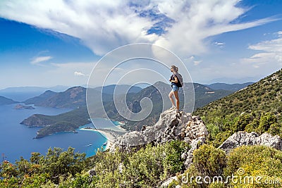 Hiker girl on the mountain top Stock Photo